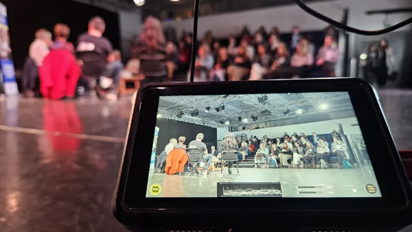Monitoring filming progress at event